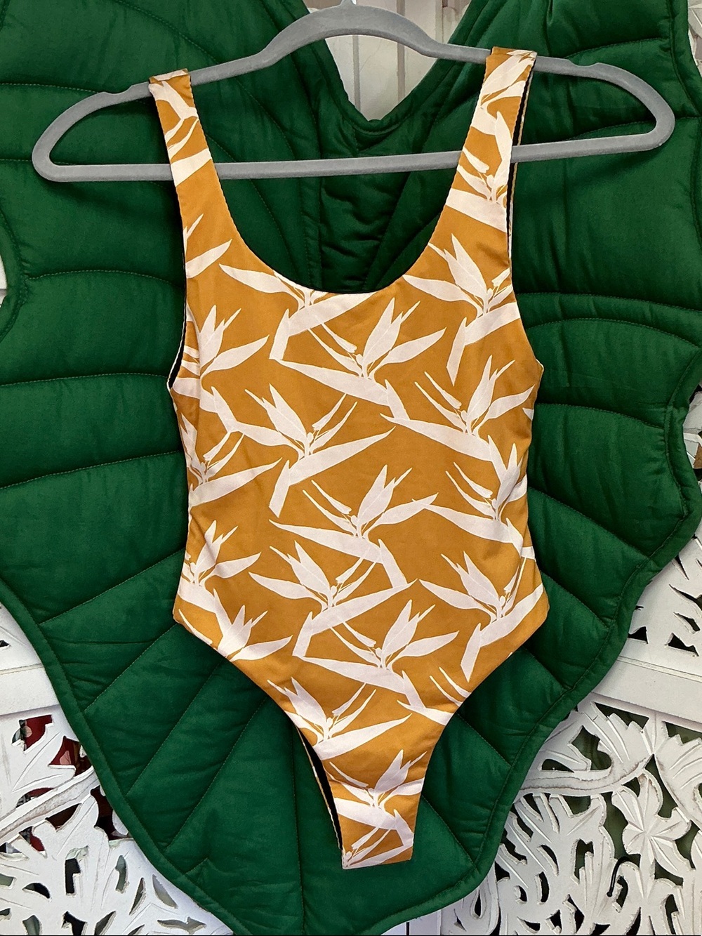 Brand new, NWOT, made in Hawaii reversible bird of paradise one piece swimsuit.